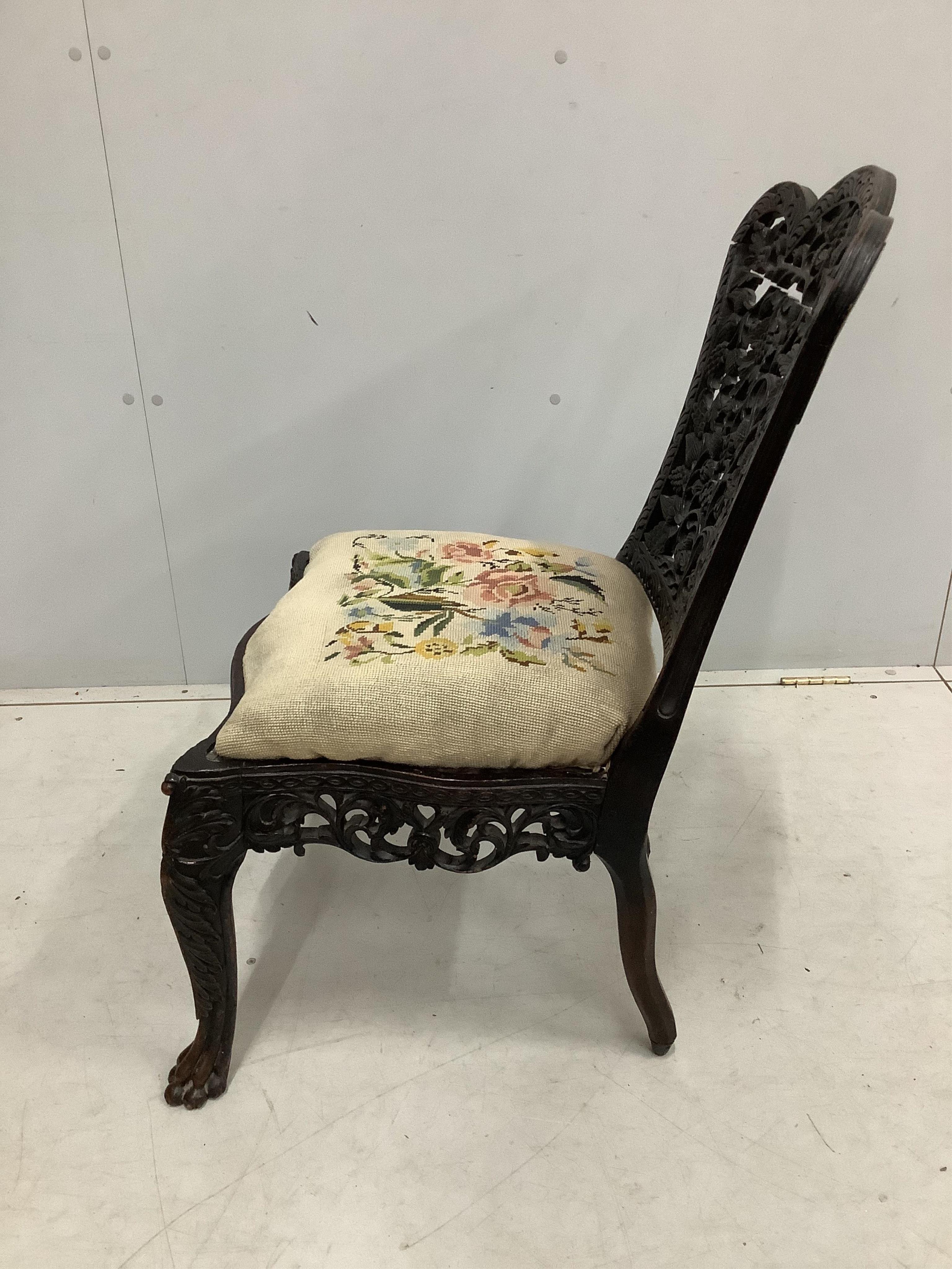 An Anglo Indian carved hardwood side chair with tapestry seat, height 81cm
